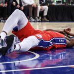 Philadelphia 76ers center Joel Embiid gathers himself after injury scare