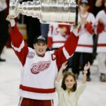 Steve Yzerman winning the NHL Stanley Cup 3 times as a player for the Red Wings