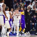 Los Angeles Lakers rookie Dalton Knecht (4) reacts after a three point basket